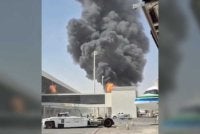 Asap dan api menjulang dari Lapangan Terbang King Khalid selepas kumpulan Houthi yang disokong Iran di Yaman mendakwa melancarkan serangan ke atas lapangan terbang itu. - Gambar Reuters