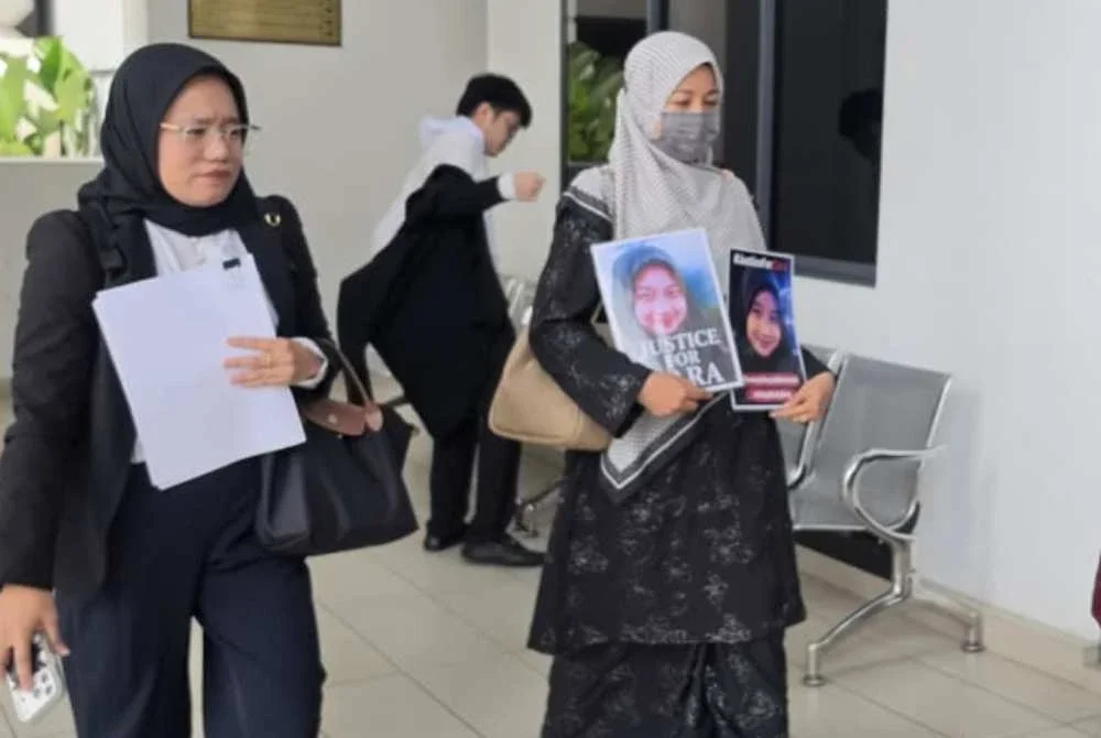 Noraidah ketika hadir di Mahkamah Kota Kinabalu.