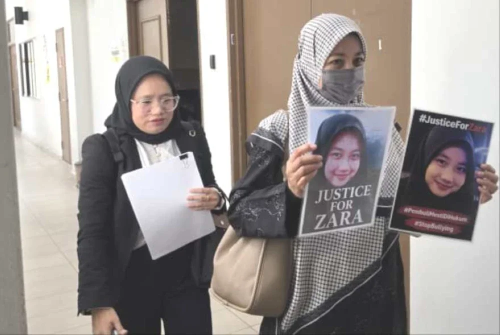 Noraidah ketika hadir di Mahkamah Kota Kinabalu.