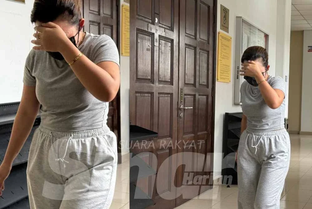 Tertuduh keluar dari Mahkamah Tinggi Melaka selepas selesai membayar ikat jamin.
