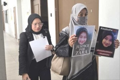 Noraidah ketika hadir di Mahkamah Kota Kinabalu.