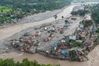 Pemandangan udara menunjukkan rumah-rumah ditenggelami lumpur susulan banjir kilat di Devighat, Perbandaran Bidur, daerah Nuwakot, Nepal. Foto: Fail/AFP
