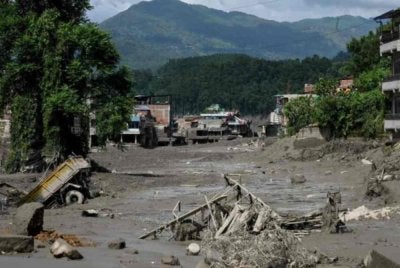 Rumah-rumah ditenggelami lumpur susulan banjir kilat di Trishuli Bazar, daerah Nuwakot, Nepal pada 26 Ogos lalu. Foto: AFP