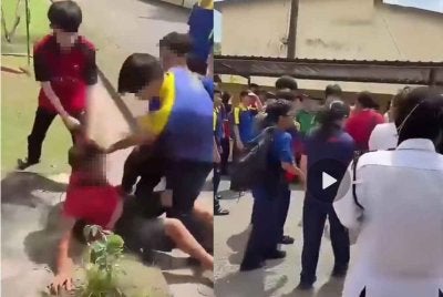 Tangkqp layar video tular berdurasi 31 saat berhubung kejadian pergaduhan melibatkan pelajar sekolah dan individu dewasa di hadapan sebuah sekolah di daerah ini.