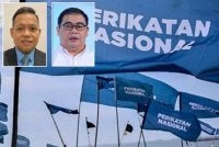 Mujibu dan Awang Azman (kanan).