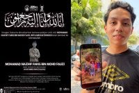Muhammad Aqil menunjukkan gambar kenangan bersama Allahyarham rakannya itu ketika bercuti bersama baru-baru ini.