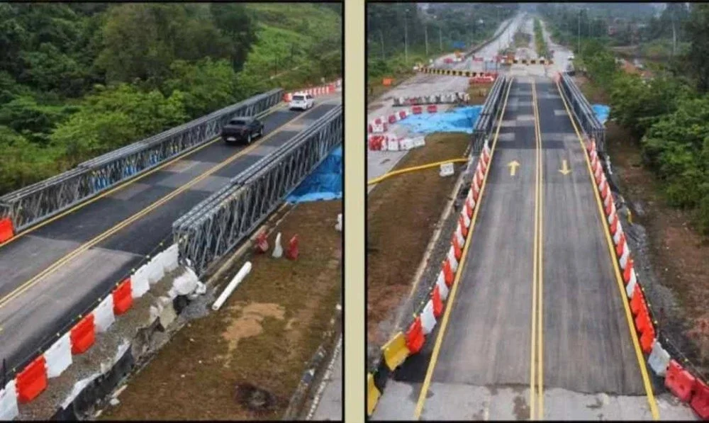 Hanya kenderaan ringan yang dibenarkan mengguna jalan lencongan sementara di lokasi lubang benam berhampiran Kelab Golf Gua Musang di Jalan Gua Musang-Kota Bharu yang dibuka bermula pada Ahad.Foto:JKR