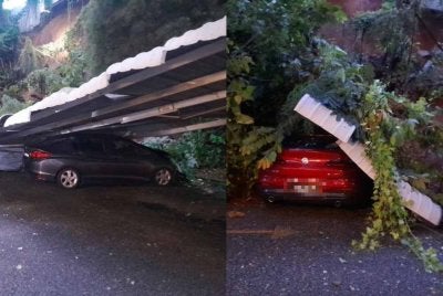 Selain Honda City, sebuah BMW turut rosak akibat kejadian tanah runtuh.