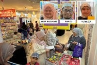 Pengunjung melihat buku yang ditawarkan menerusi promosi 'Sebakul RM50' ketika Jualan Gudang Karangkraf di Shah Alam pada Jumaat. 