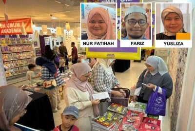 Pengunjung melihat buku yang ditawarkan menerusi promosi 'Sebakul RM50' ketika Jualan Gudang Karangkraf di Shah Alam pada Jumaat. 